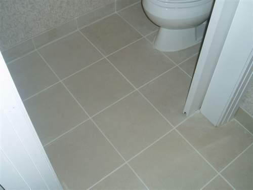 Clean ceramic tile floor after professional restroom cleaning in Burlington